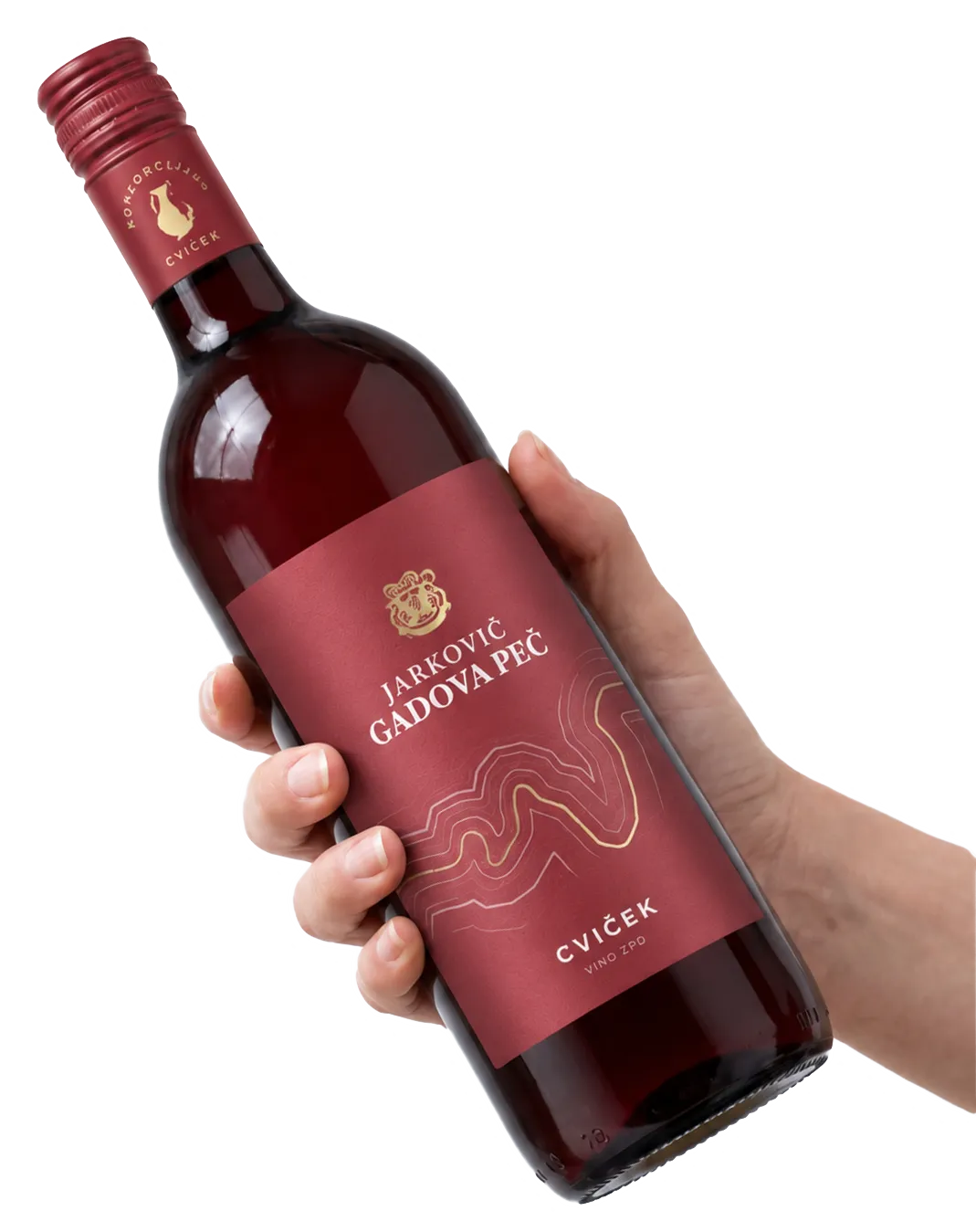 Roka drži steklenico belega vina Gadovec Jarkovič Gadova peč iz Dolenjske